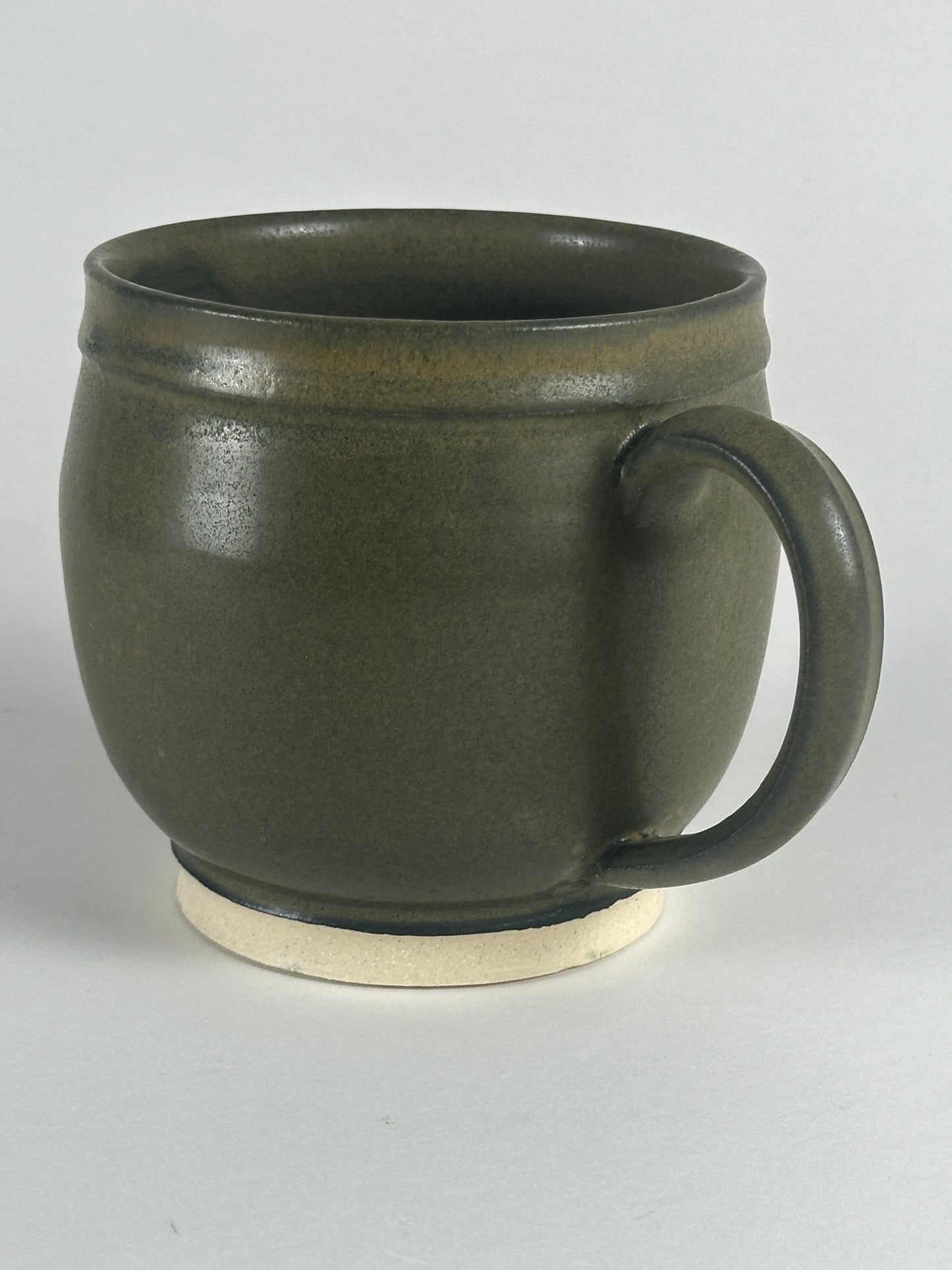 large round dark green mugs